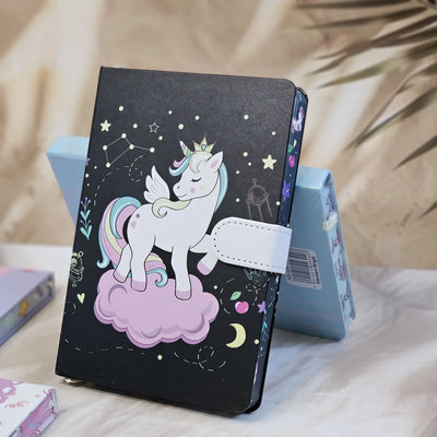 Set of four small unicorn-themed notebook diaries for kids, each with a lock, displayed on a textured surface." www.usmile.toys