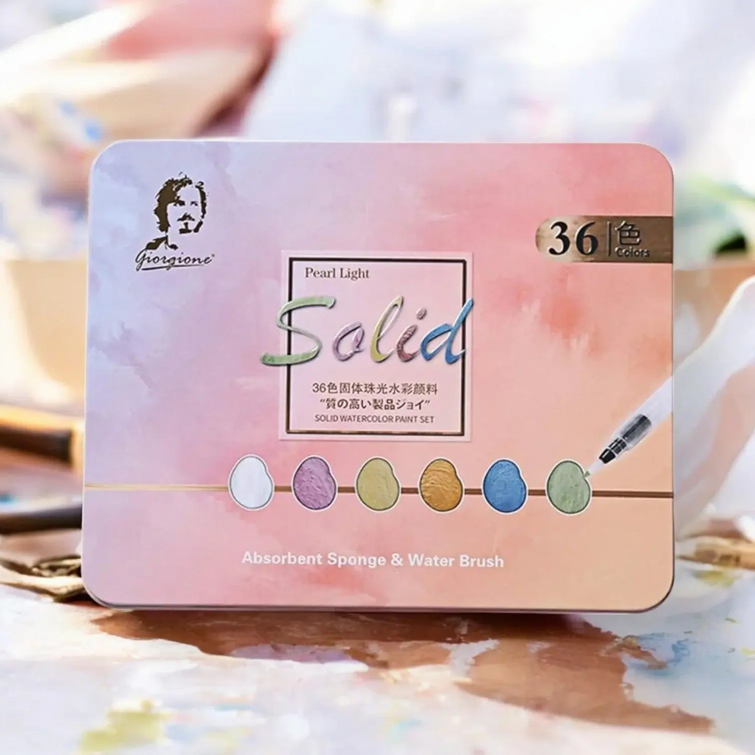 "Usmile Toys Giorgione 36-color solid watercolor paint set in a rectangular tin, featuring 'Pearl Light' colors and including an absorbent sponge and water brush." www.usmile.toys