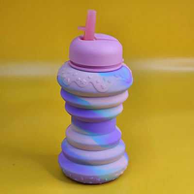 BPA-free and collapsible silicone sipper bottle with a playful donut design, perfect for school, travel, and playtime for kids www.usmile.toys
