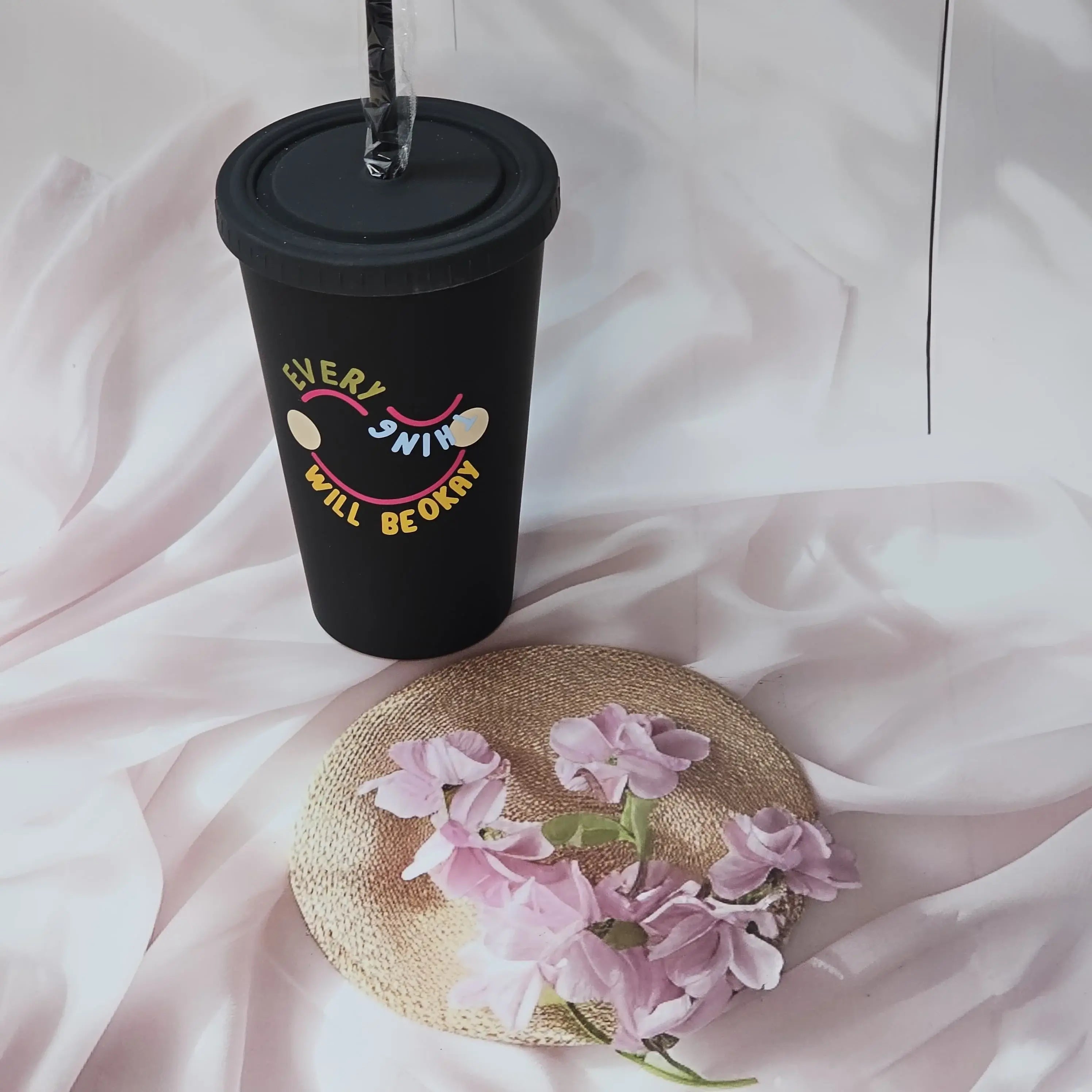 Trendy black sipper cups with "EVERYTHING WILL BE OKAY" and "A GOOD START" quotes, colored lids and straws, perfect for return gifts from www.usmile.toys